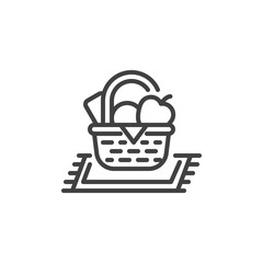Picnic blanket with a basket of food line icon