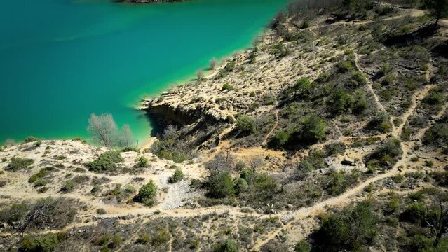 Lac de St croix in the gorges du verdon, vertical view made by drone in 4k 60fps view of the turquoise water and the beaches of the lake. Famous tourist site