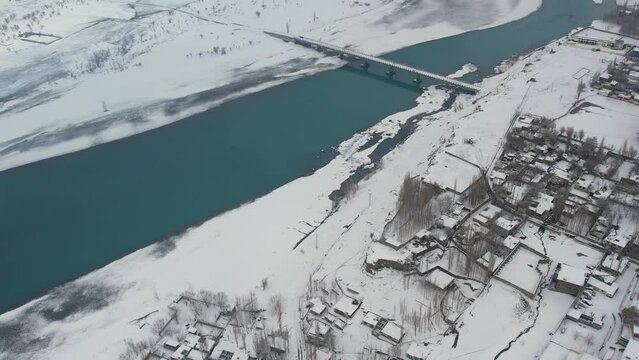 Drone shot of snow covered Skardu city in winter season of Pakistan. Aerial view.