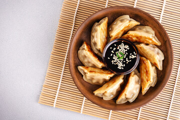 Japanese dumplings Gyoza with soy sauce. Top view.