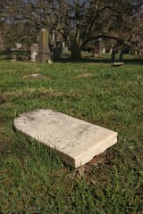 An old fallen tombstone.