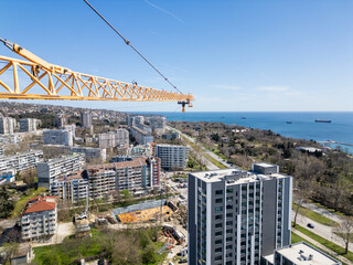 Aerial View of City With Crane