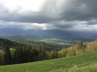 Cloudy sky above green hills. Slovenia.