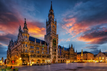 Beautiful view of the Marienplatz square in Munich, Germany, with the new city hall during a colorful sunrise without people - 779544121
