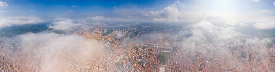 Bologna, Italy. Historical Center. Panorama of the city on a summer day. Flying in the clouds. Panorama 360. Aerial view