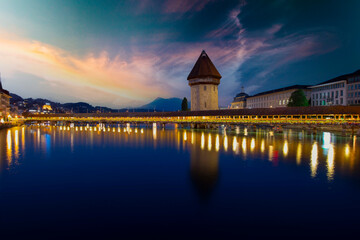 Sunset in historic city center of Lucerne with famous Chapel Bridge and lake Lucerne...