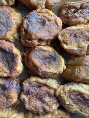 A plate of cinnamon rolls with brown glaze torrijas typical dessert from spain