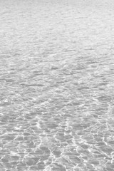 ripples in the water in a faded black and white background