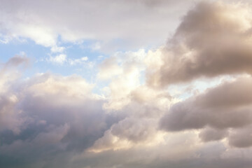 Softly lit clouds at dusk, portraying a peaceful and contemplative sunrise sky scene