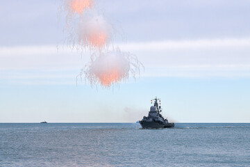Russian warship fired decoy flares for self defense, sailing at sea military ship used anti missile...