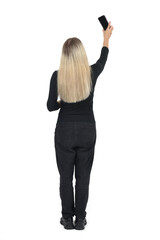 rear view of a woman taking a selfie on white background - 779568373