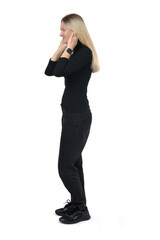 side view of woman covering her ears from noise on white background - 779568399