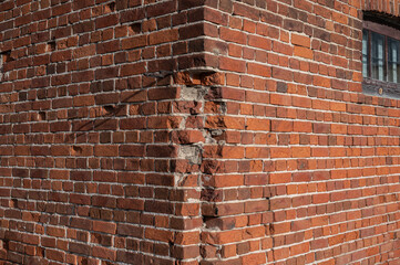 Corner of an old brick building as a background.