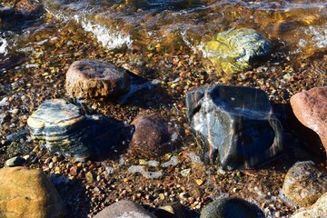 Closeup shot of wet rocks near the water