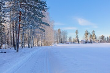 The snow has been plowed from the road in cold winter weather, Loppi, Finland.