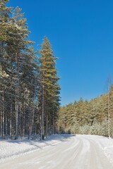 The snow has been plowed from the road in cold winter weather, Loppi, Finland.