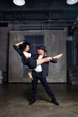 Couple dancers or performers showcase talent on stage in a contemporary dance show, dressed in...