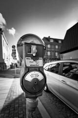 Closeup of parking meter in black and white
