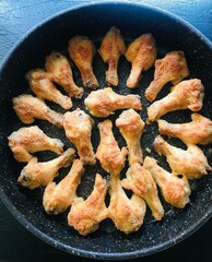 Fried chicken wings in close up - 779592323