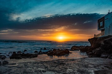 Beautiful golden sunset at the beach of El Cotillo, in la Oliva, the Fuerteventura island, Spain