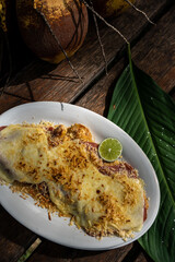 Beautiful shot of a tasty meal with meat and covered with cheese