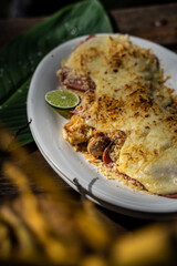 Beautiful shot of a tasty meal with meat and covered with cheese