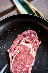 Piece of raw beef steak with spices