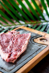 Piece of raw beef steak with spices