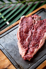 Piece of raw beef steak with spices