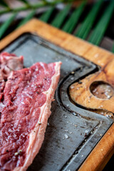 Piece of raw beef steak with spices