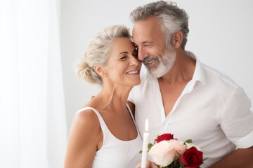 Middle-aged man celebrating his wedding anniversary with his wife Romantic, warm atmosphere