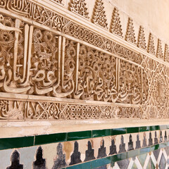 Richly detailed Arabic style wall decorations in the Royal Nazaries Palace in Alhambra, Granada, Andalusia, Spain