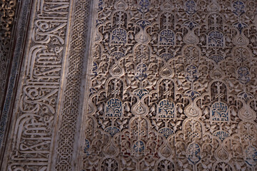 Richly detailed Arabic style wall decorations in the Royal Nazaries Palace in Alhambra, Granada, Andalusia, Spain