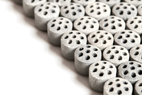 Carbon dioxide reforming of methane. Nickel catalyst seven holes cylinder pellet form shape methanol synthesis industrial petrochemical diagonal view close up shot texture background with copyspace.