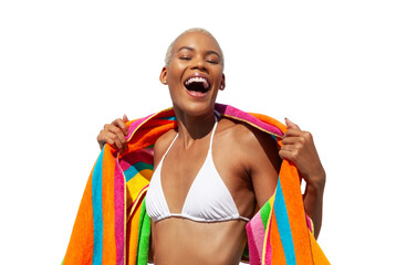 Happy laughing woman wrapped in a colorful towel, African latin American woman isolated on white background. Concept of summer beach holiday or booking travel and resort accommodations or for shopping