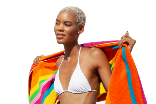 Woman wrapped in a colorful towel, African latin American woman isolated on white background. Concept of summer beach holiday or booking travel and resort accommodations or for shopping