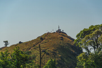 A group of people are walking up a hill
