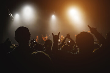 Fototapeta premium Energetic Concert Crowd Silhouettes -the electrifying atmosphere of a live concert.