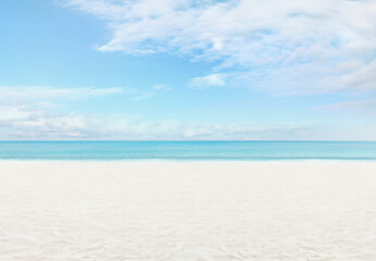 Panoramic view of the beach with turquoise sea sands and a sunlit azure sky with clouds. Banner...