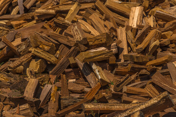 A pile of wood with many pieces of wood on top of each other