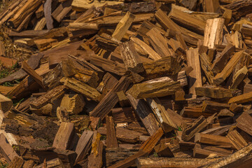 A pile of wood with many pieces of wood in it