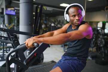 healthy african american man exercising in gym