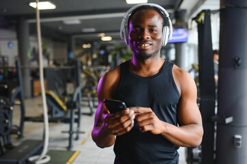 Young African-American man in a gym preparing to exercise