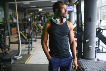 Sports, fitness, healthy lifestyle. African man in the gym.