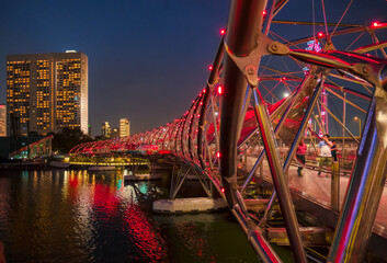 view of the Helix Bridge at the night. Helix Bridge is a pedestrian bridge linking Marina Centre with Marina South in the Marina Bay area in Singapore.