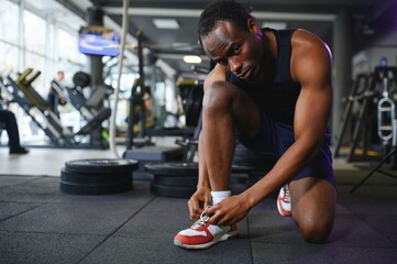 Young African-American man in a gym preparing to exercise