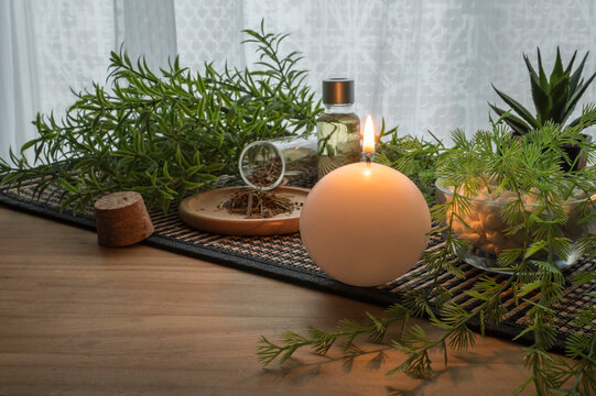 Background image of lit candle with spa decoration objects. 