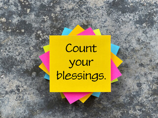 Motivational and inspirational wording. Count Your Blessings written on adhesive paper. 