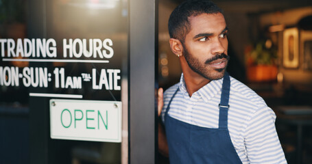 Man, coffee shop and open sign on front door with waiting for customer, thinking and service in...