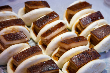 Chinese bao stuffed with roasted pork belly cooked in the Chinese district of Nankinmachi in the city of Kobe in Japan.